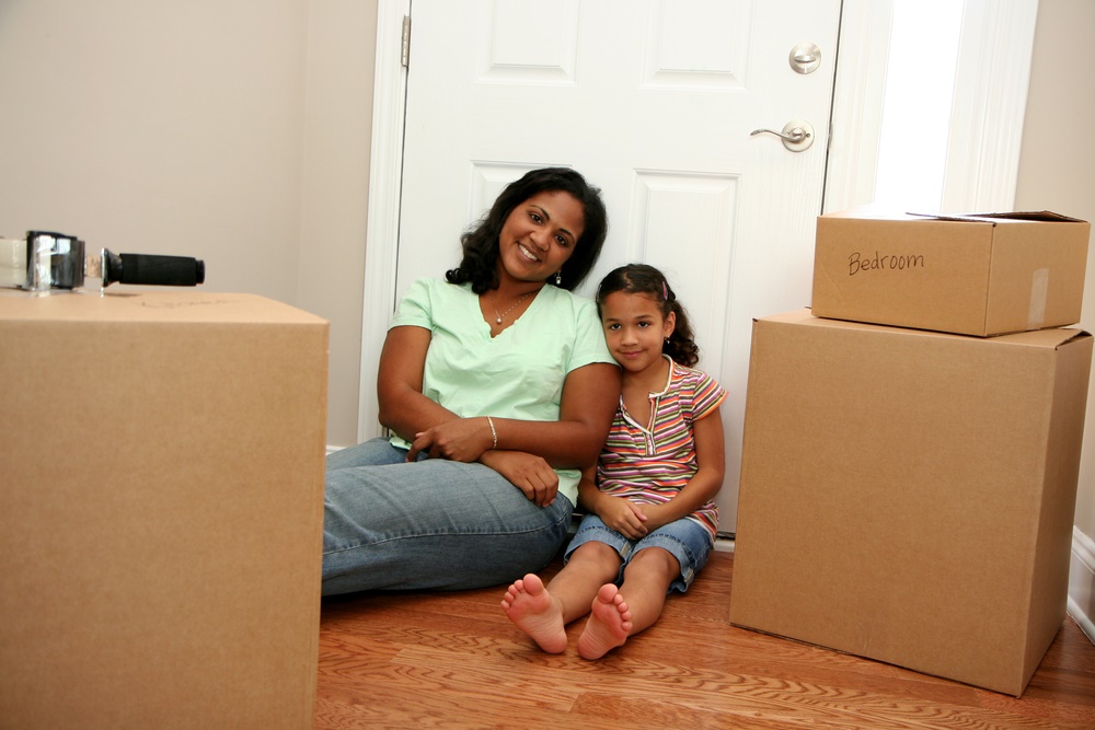 mother and daughter packing to move