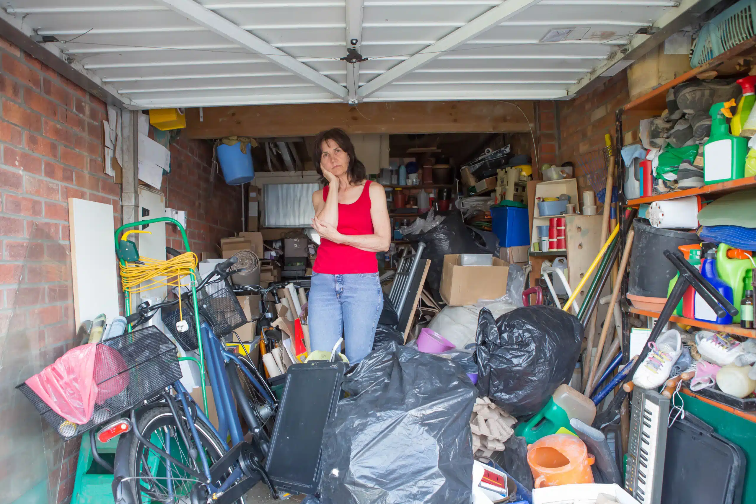 women inside cluttered garage